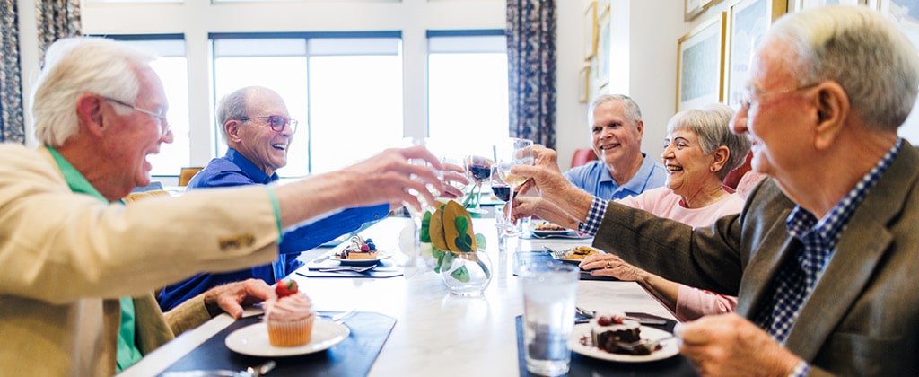 group of elderly toasting