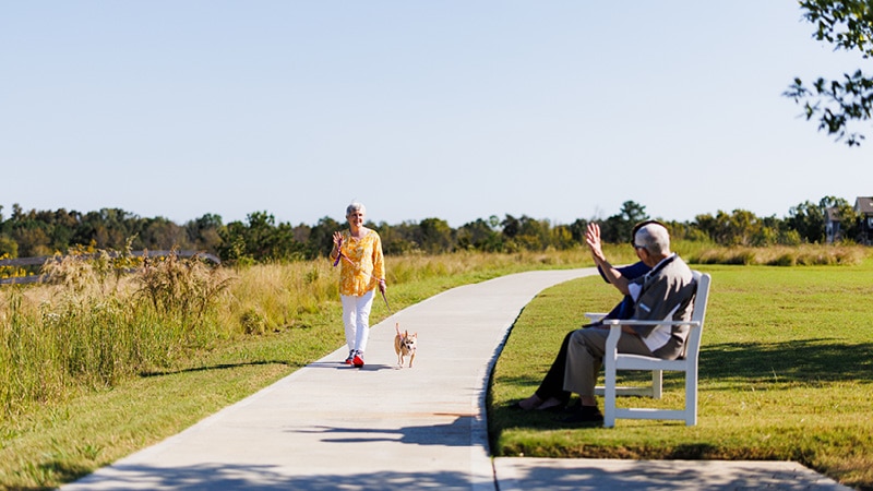 lady walking dog in the park2