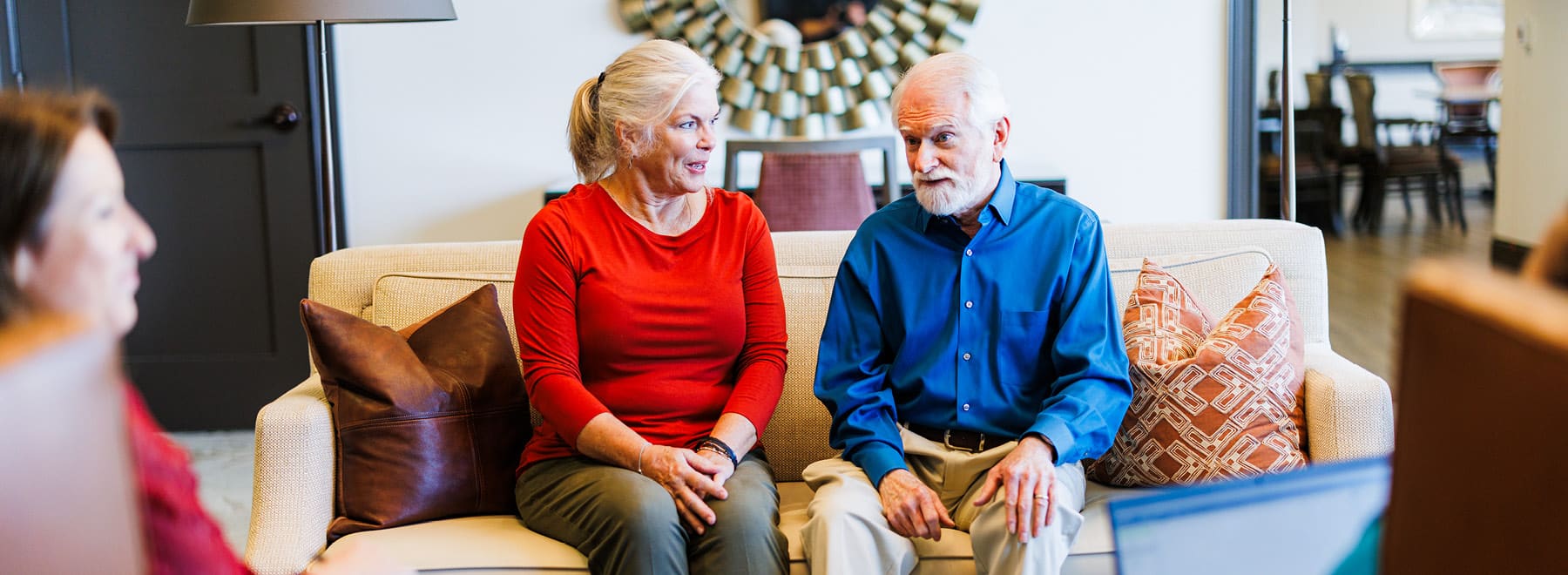 elderly couple sitting on a couch together2