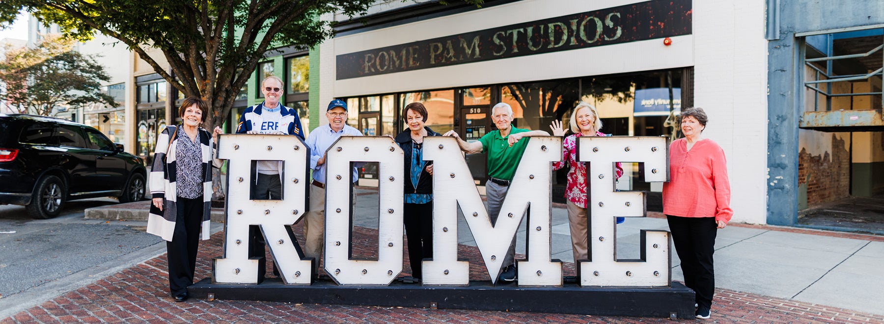 people standing in front of giant sign3