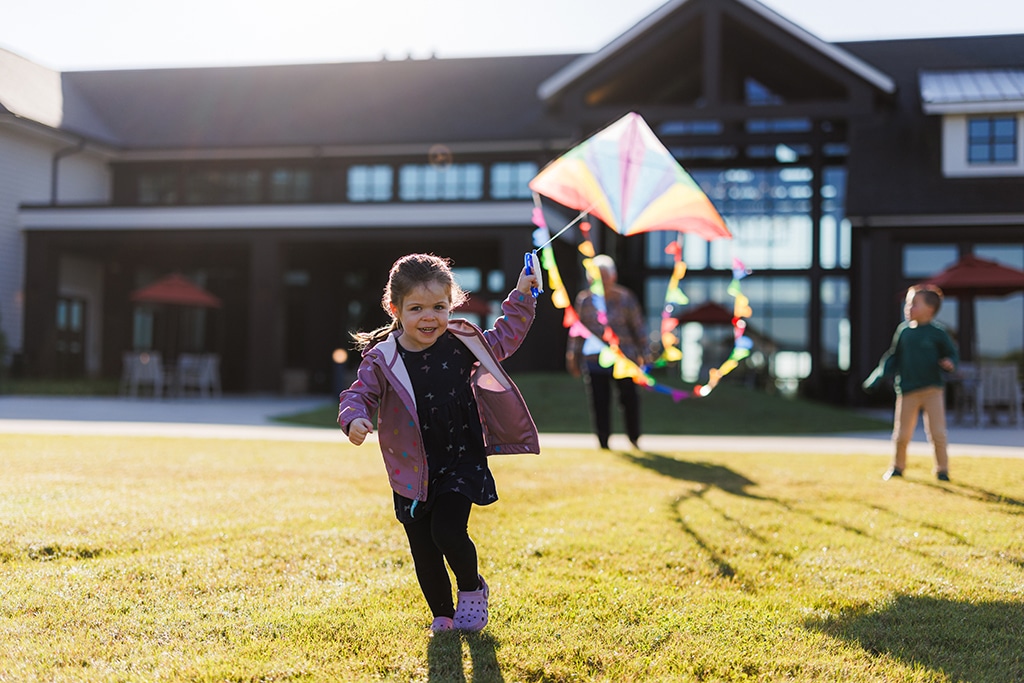 child flying a kite