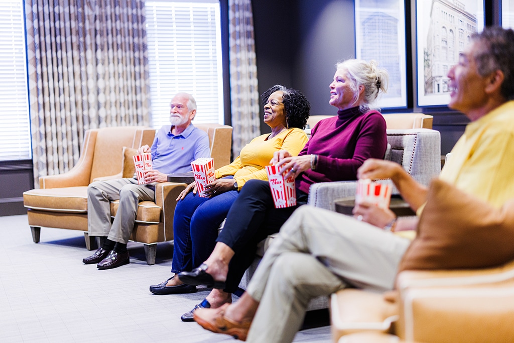 group of elderly watching a movie