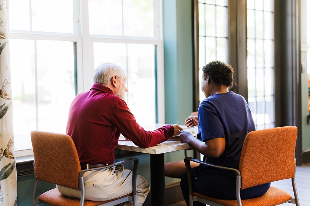man and women sitting at a table together